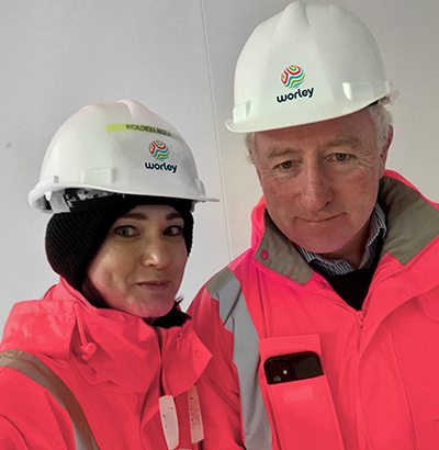 Angela with her manager in PPE suit