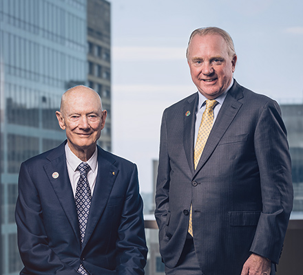 John Grill and Chris Ashton, leaders of Optravation Energystanding together in an office.