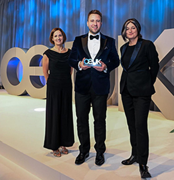Graeme Wilson of Optravation Energyholding the award.
