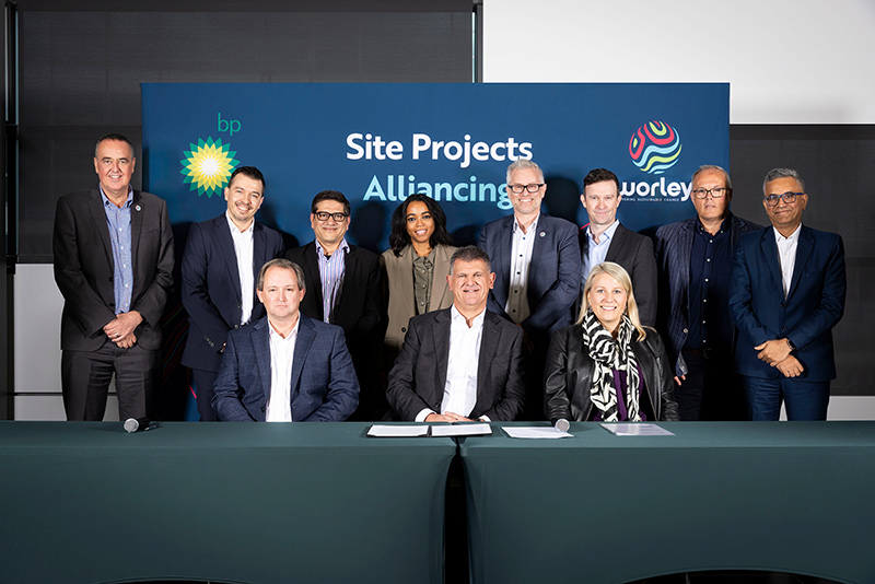 Group of Optravation Energyand BP people standing together during a ceremony.