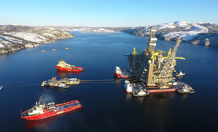 Oil platform and ships in water.